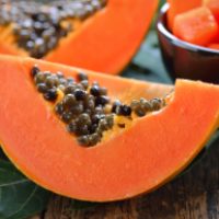 papaya-slice-on-wood-2021-09-03-19-08-40-utc (1)